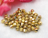 Swarovski 5301 6mm Crystal 2X aurum - 24K Gold - 62 St�ck